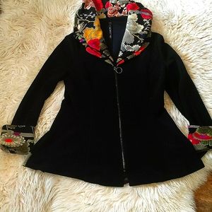 I C Collection zippered black jacket with floral collar and sleeves.